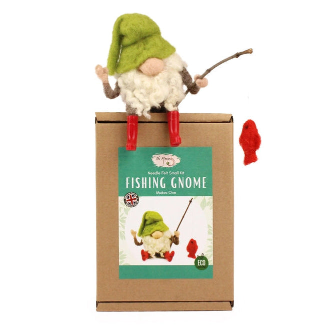 Needle felted Fishing gnome on top of its packaging with a label indicating it is a 'Fishing Gnome'.