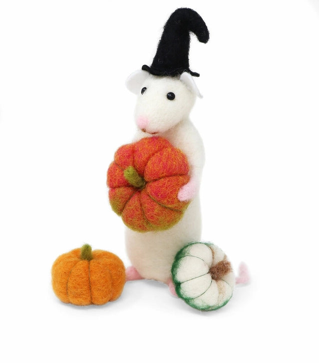 A white felt mouse wearing a black witch hat and holding an orange felt pumpkin, with two small felt pumpkins on a white background.