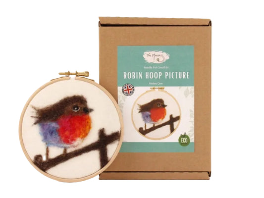 Embroidery hoop with robin design and packaging on a white background