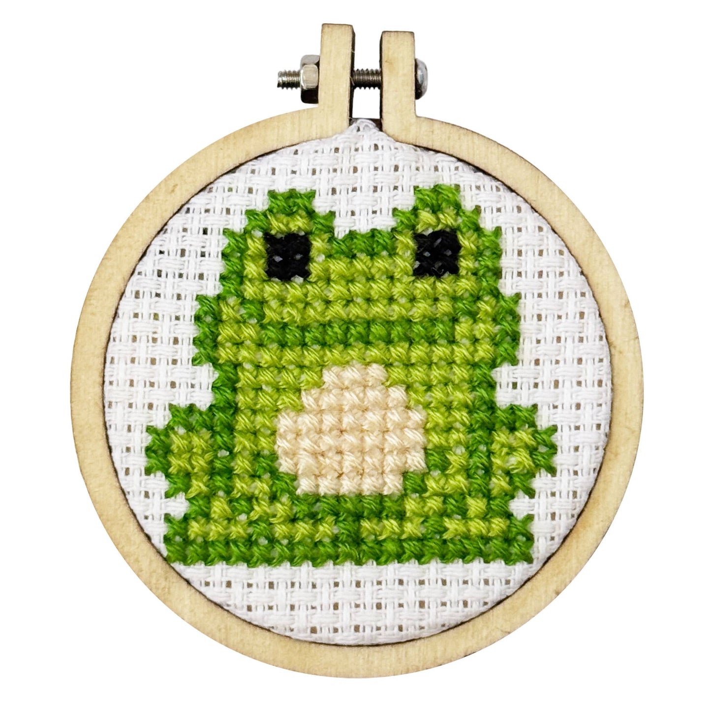 Cross-stitched green character in a wooden hoop on a white background