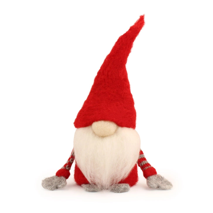 Red gnome figurine with a white beard on a white background